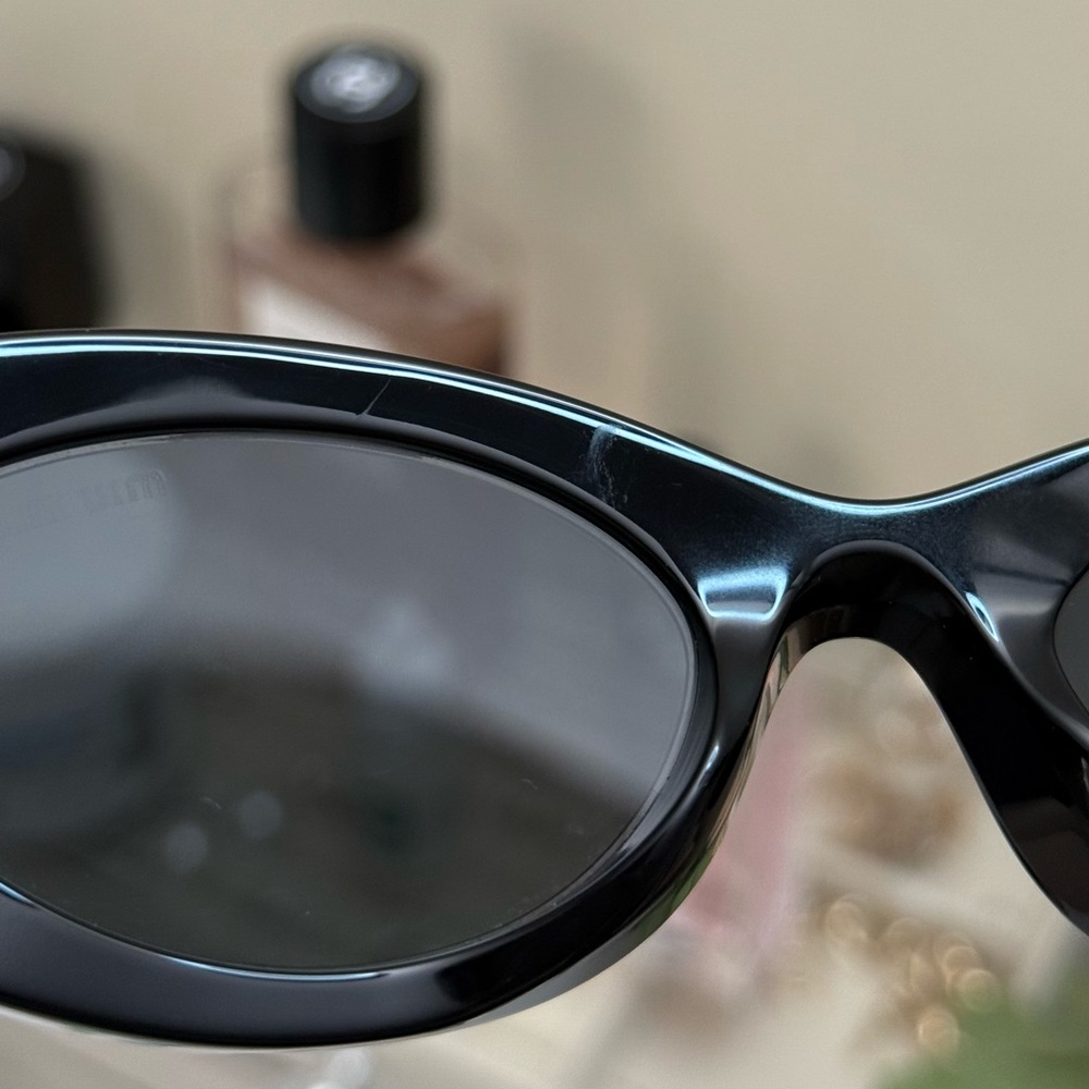 Miu Miu Black Oval Sunglasses with Gold Logo Temples - Picture 13 of 14